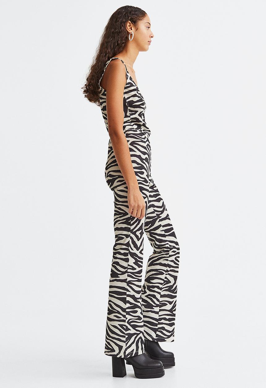 H&M - Glittery flared leggings - black/zebra print