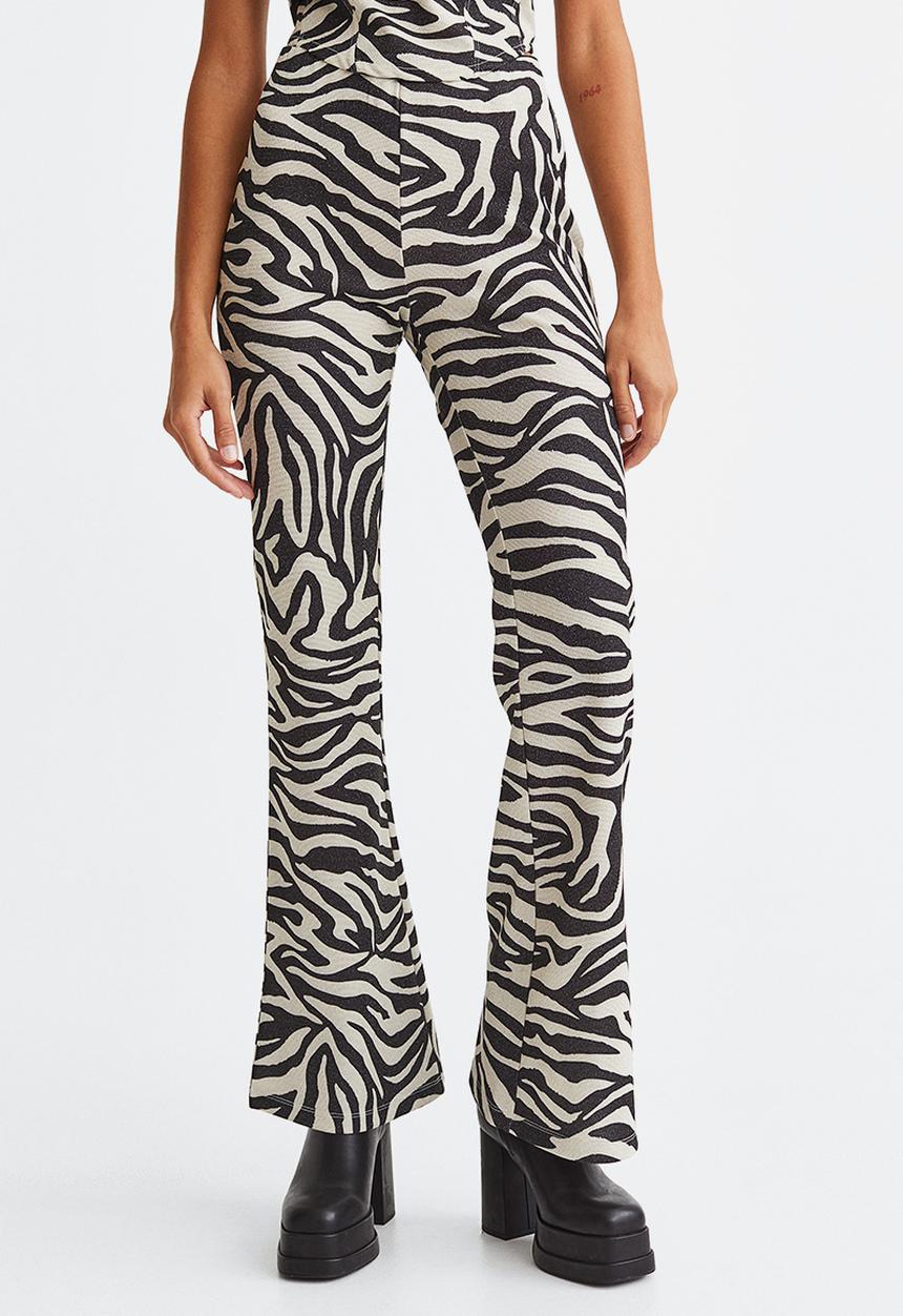 H&M - Glittery flared leggings - black/zebra print