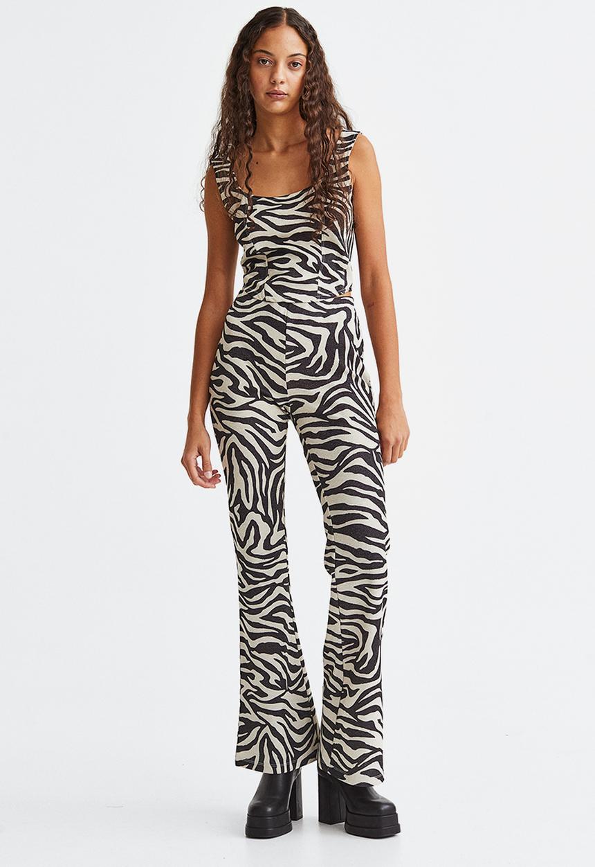 H&M - Glittery flared leggings - black/zebra print