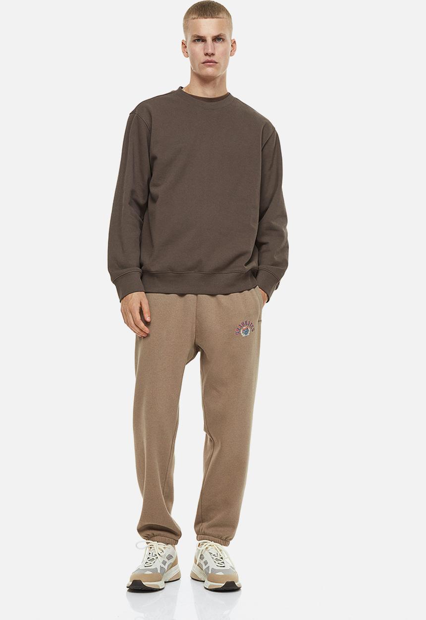 H&M - Relaxed fit printed sweatpants - beige/graduates