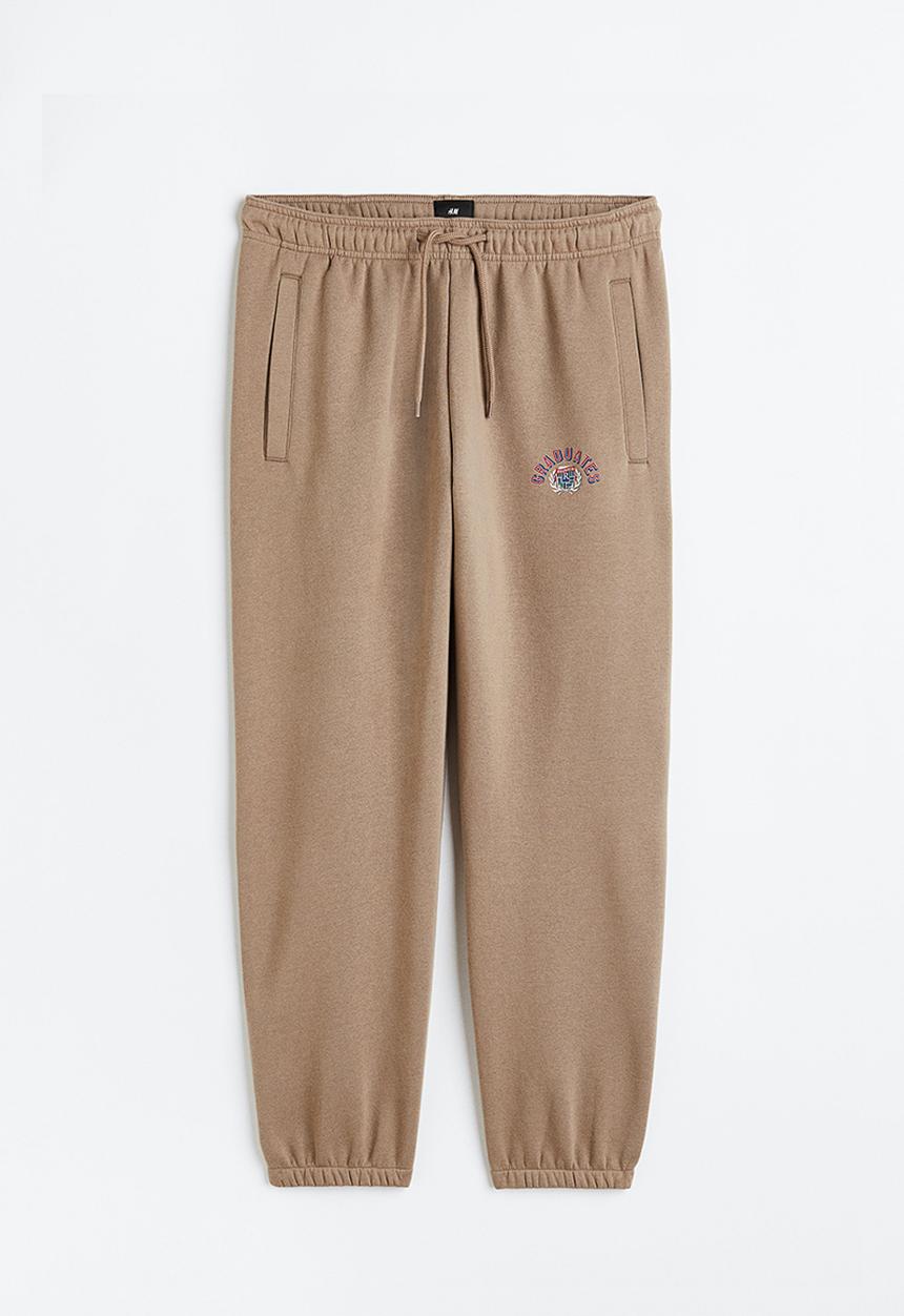 H&M - Relaxed fit printed sweatpants - beige/graduates