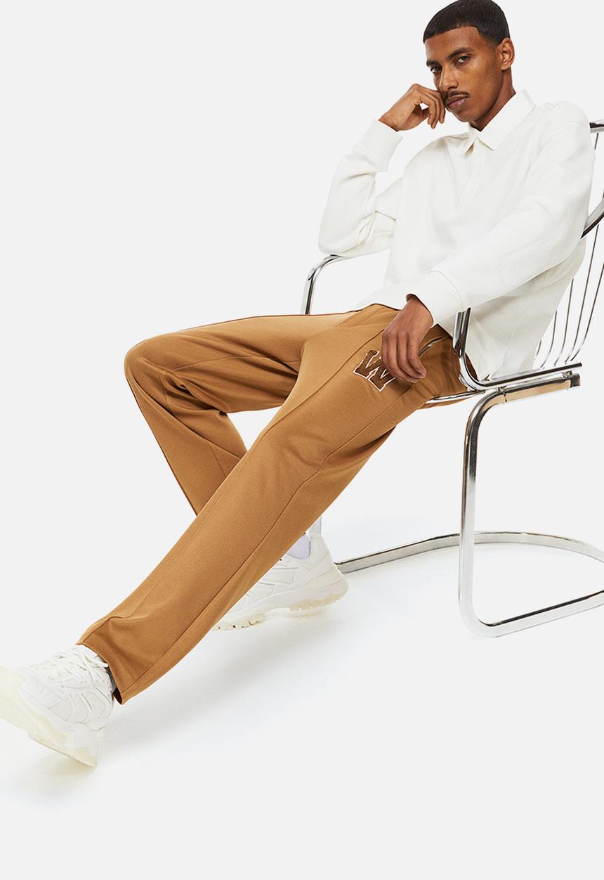 H&M - Regular fit dressy joggers - dark beige/w