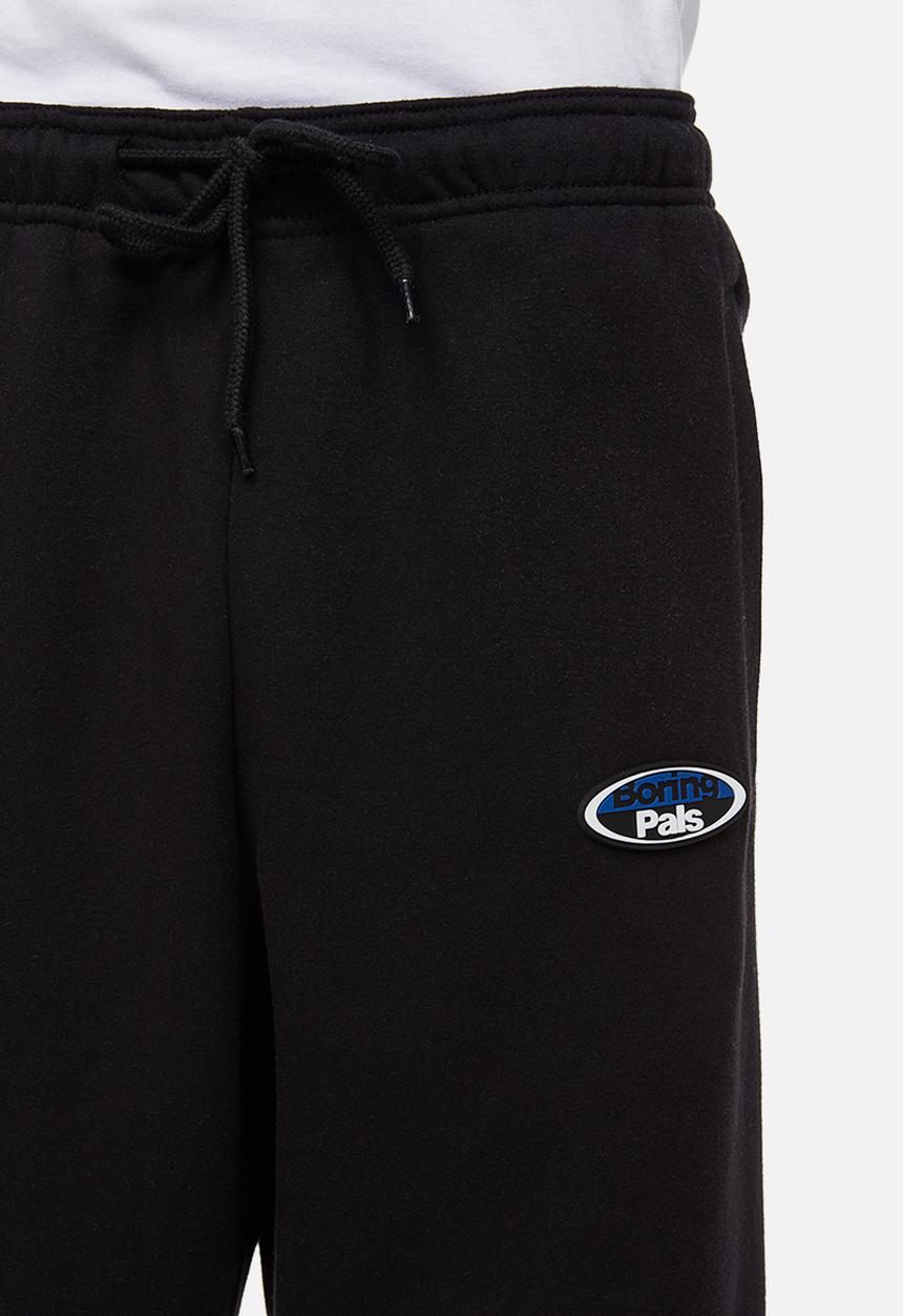 H&M - Relaxed fit printed sweatpants - black/boring pals