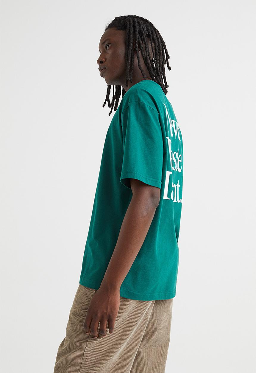 H&M - Relaxed fit printed t-shirt - dark green/never waste talent 