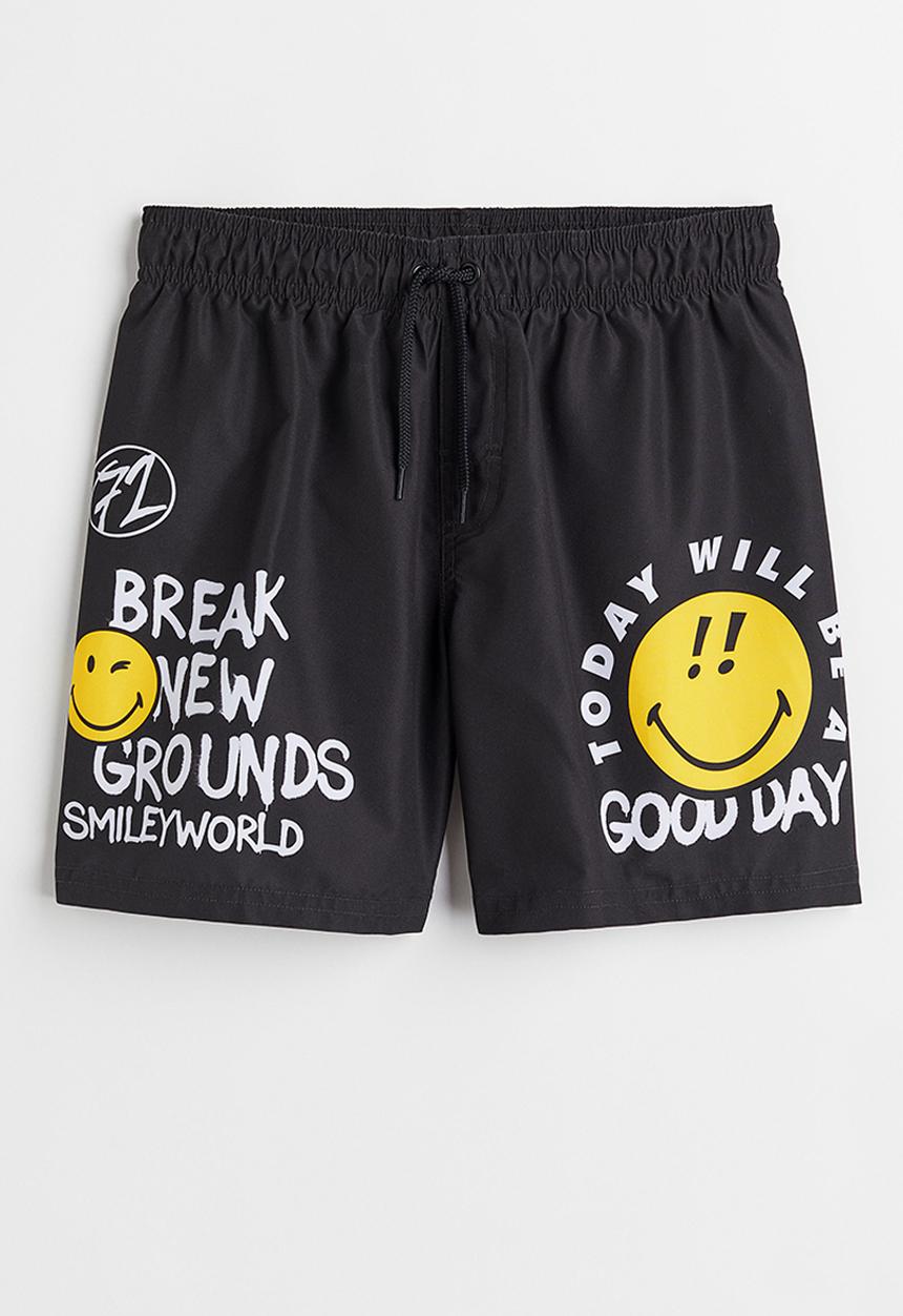 H&M - Printed swim shorts - black/smileyworld® 