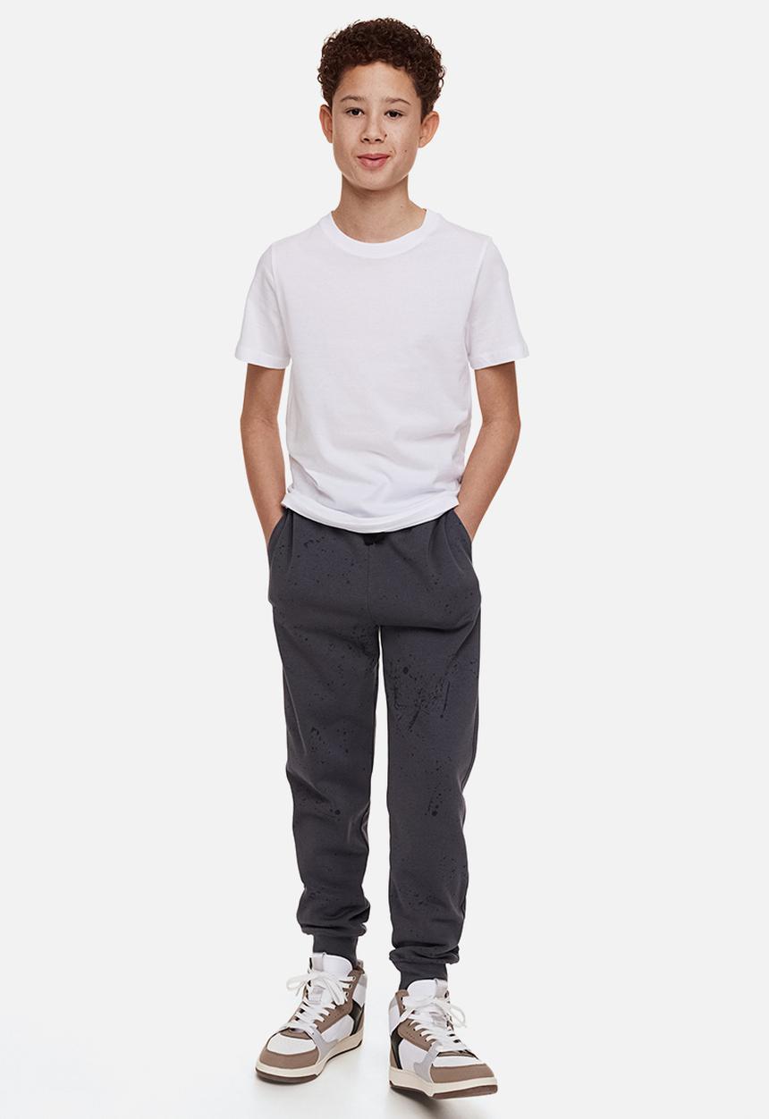 H&M - Printed joggers - dark grey/splatter print