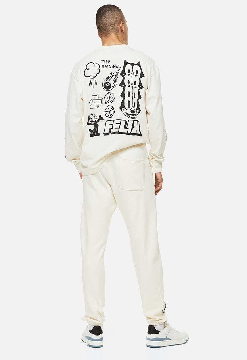 H&M - Regular fit sweatpants - cream/felix the cat 