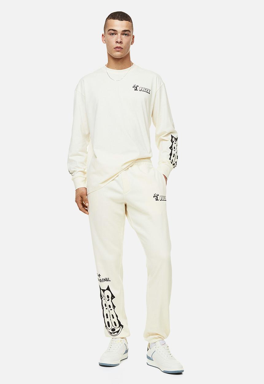 H&M - Regular fit sweatpants - cream/felix the cat 