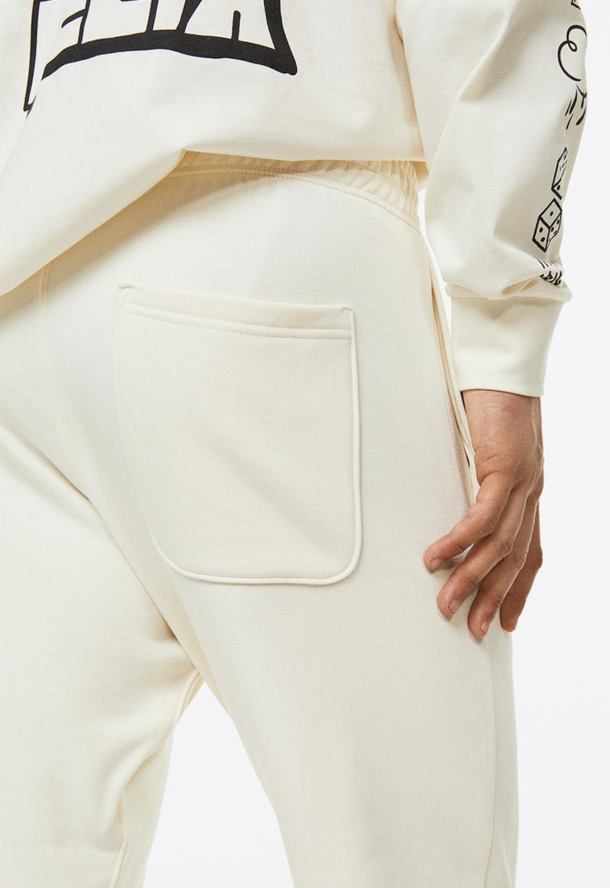 H&M - Regular fit sweatpants - cream/felix the cat 