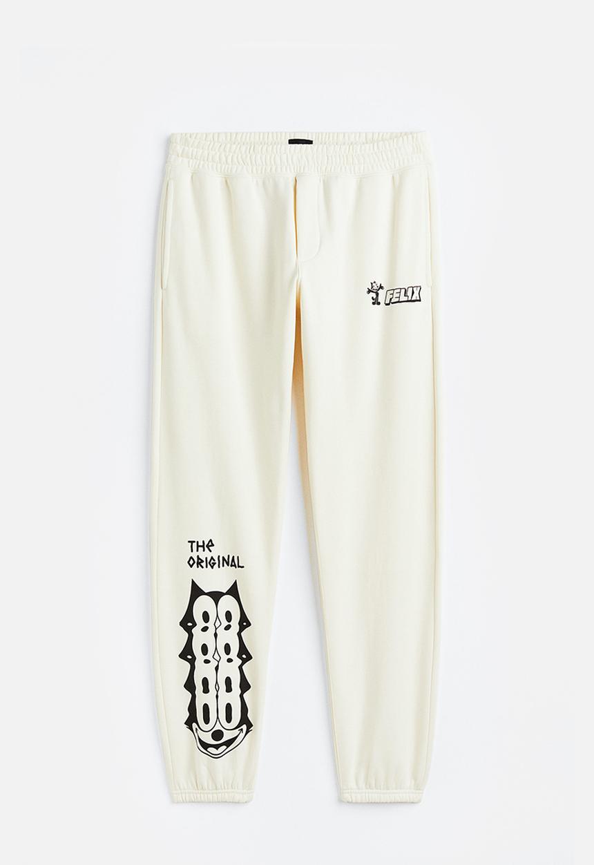H&M - Regular fit sweatpants - cream/felix the cat 