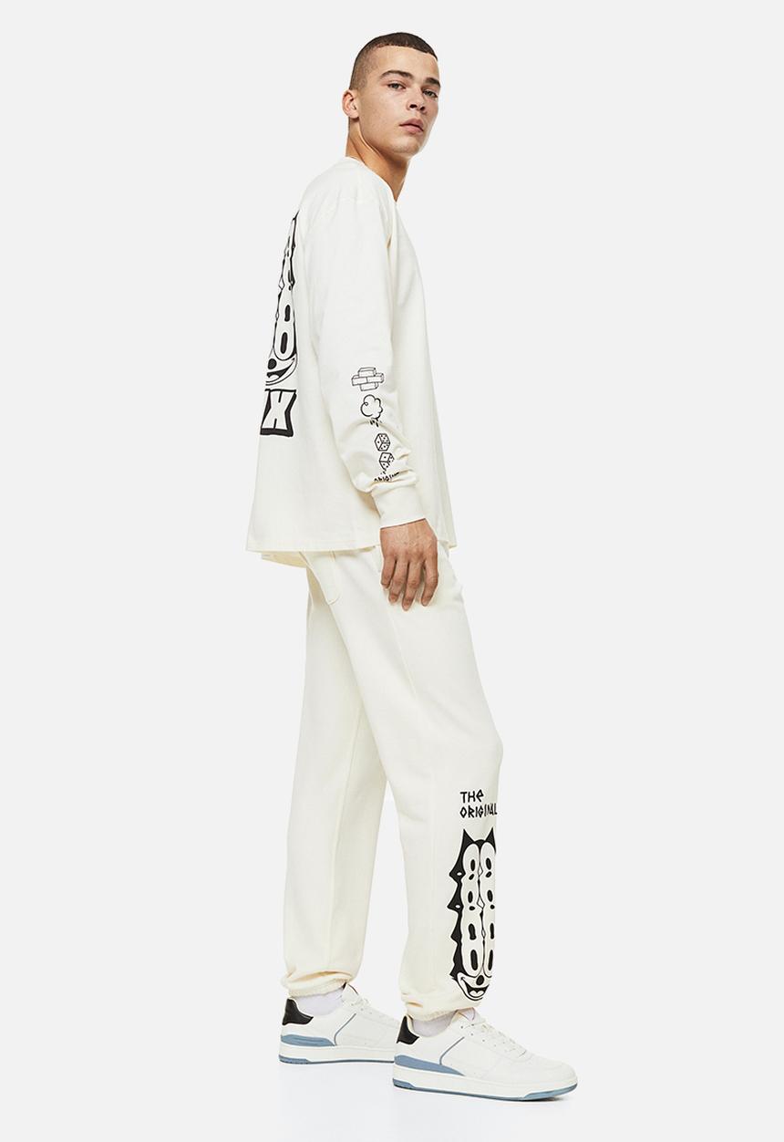 H&M - Regular fit sweatpants - cream/felix the cat 