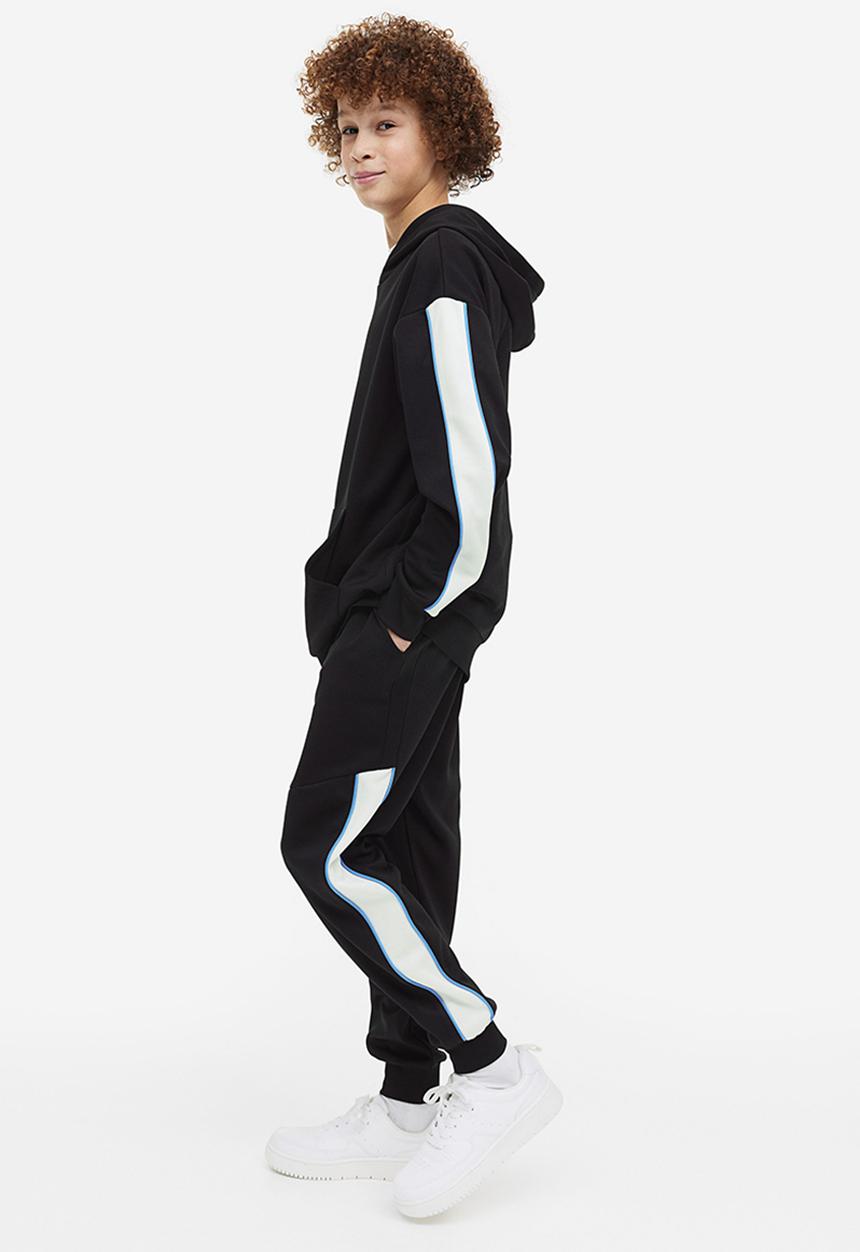H&M - Track pants - black/block-coloured 