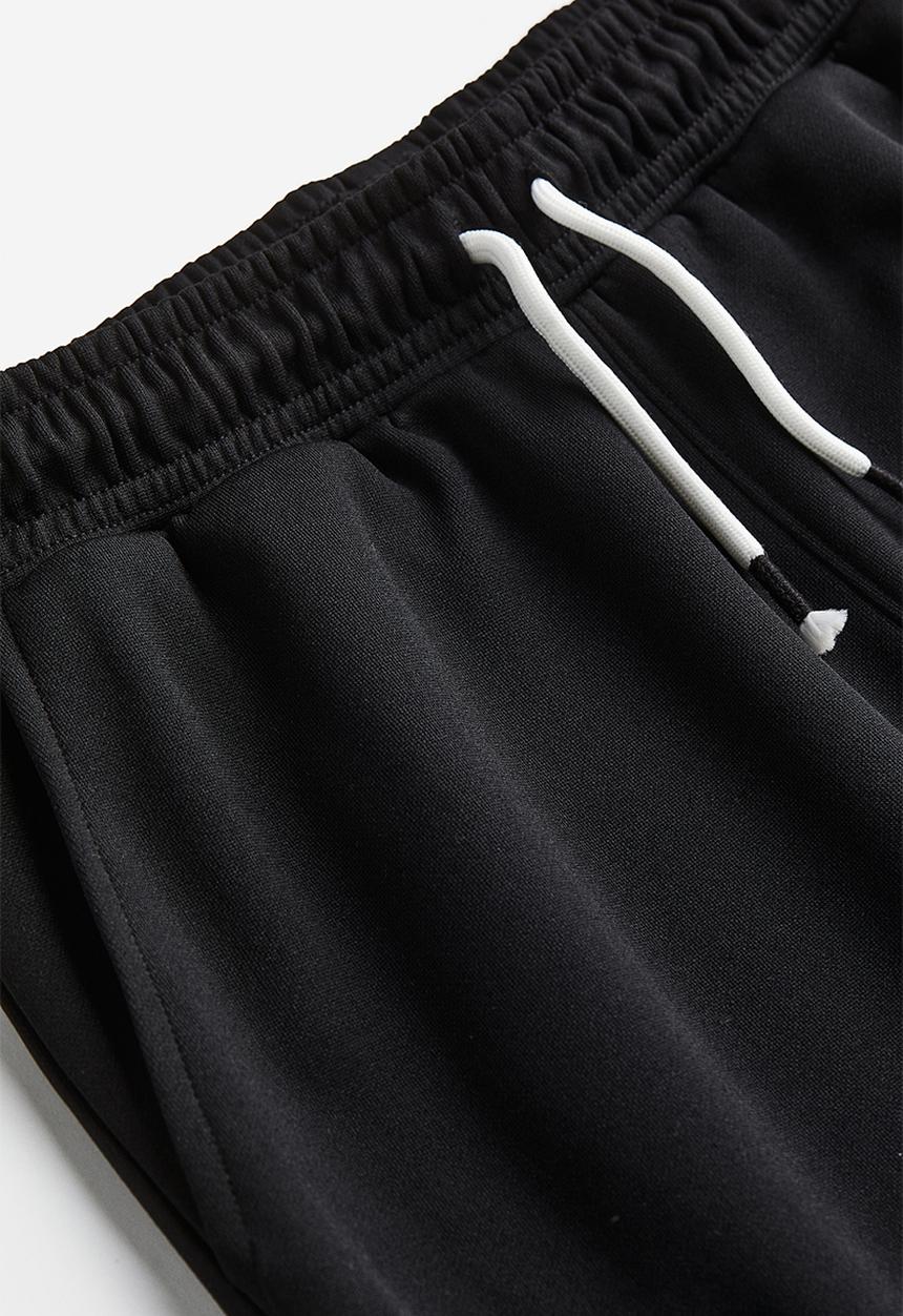 H&M - Track pants - black/block-coloured 