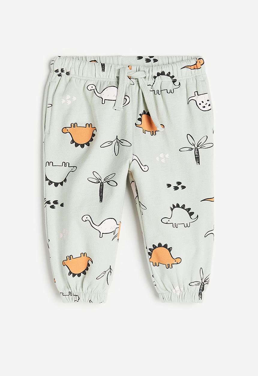 H&M - Cotton joggers - light sage green / dinosaurs 