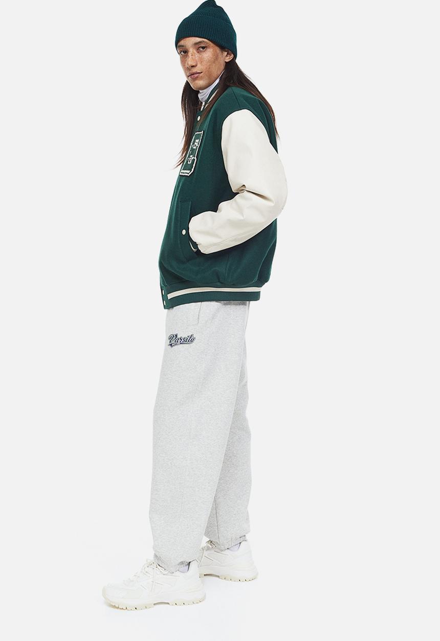 H&M - Loose fit printed sweatpants - light grey marl/varsity
