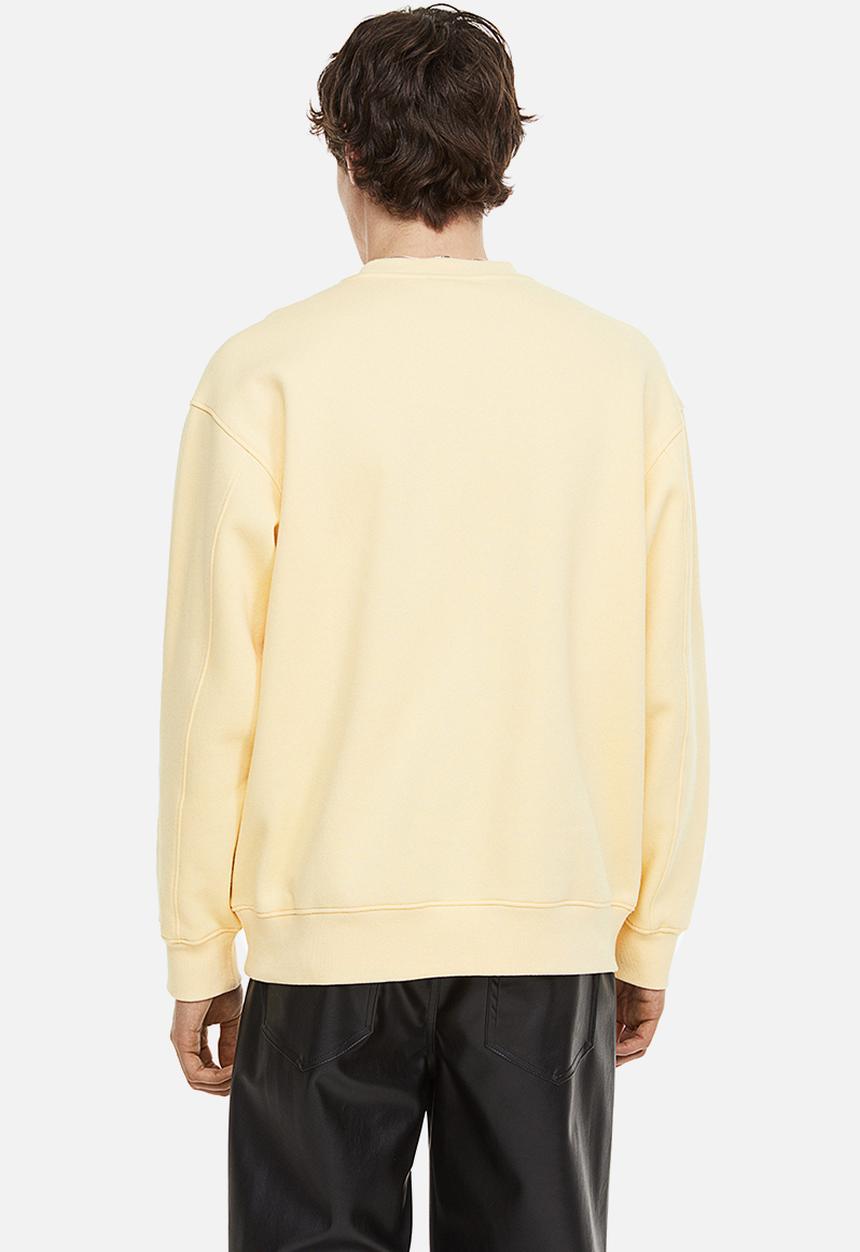 H&M - Relaxed fit appliquéd sweatshirt - light yellow