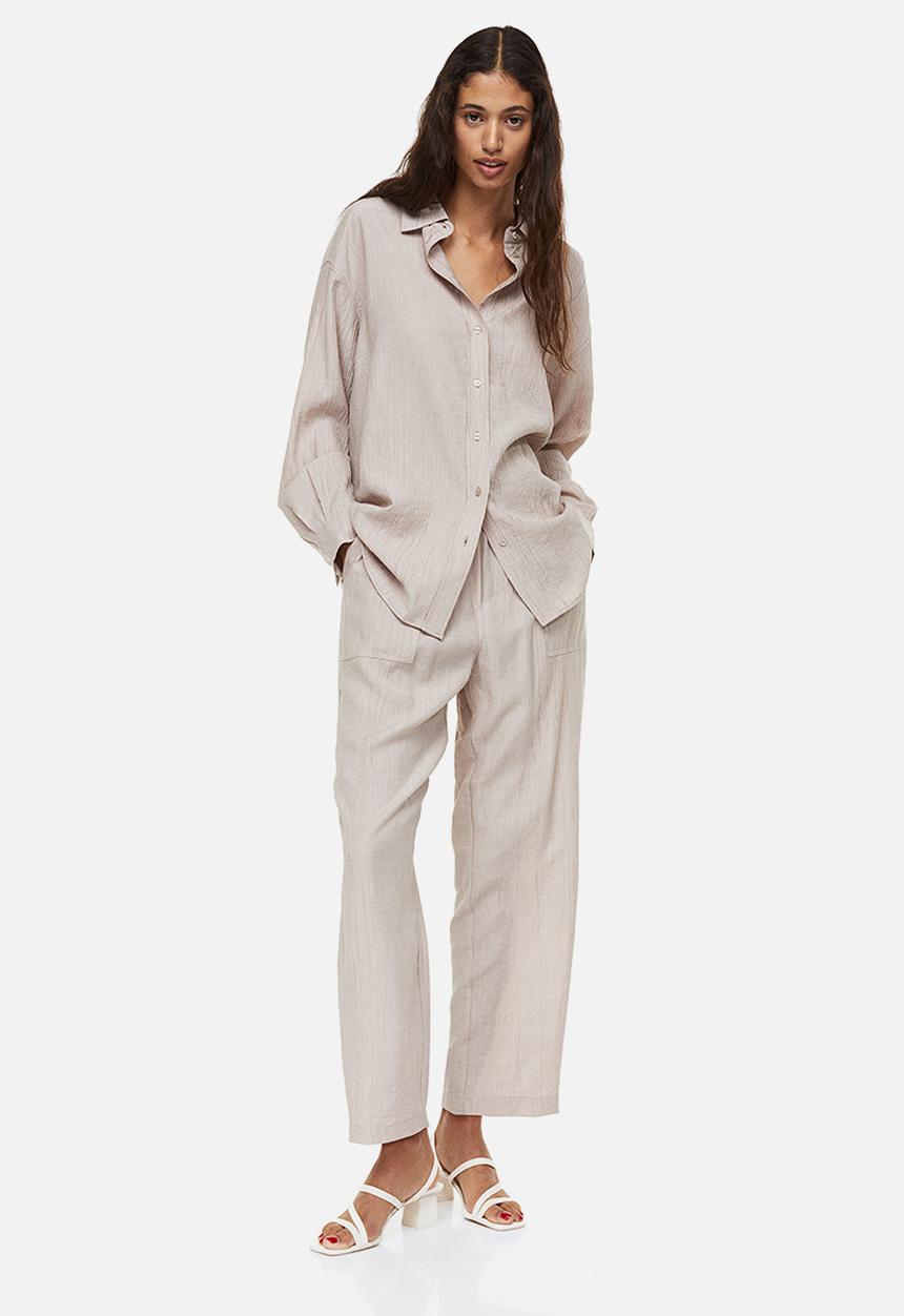 H&M - Tapered trousers - light beige 