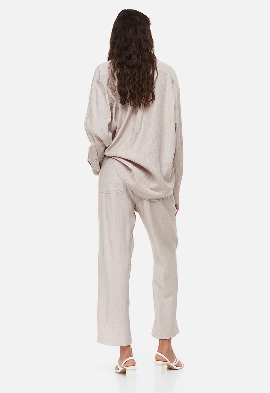 H&M - Tapered trousers - light beige 