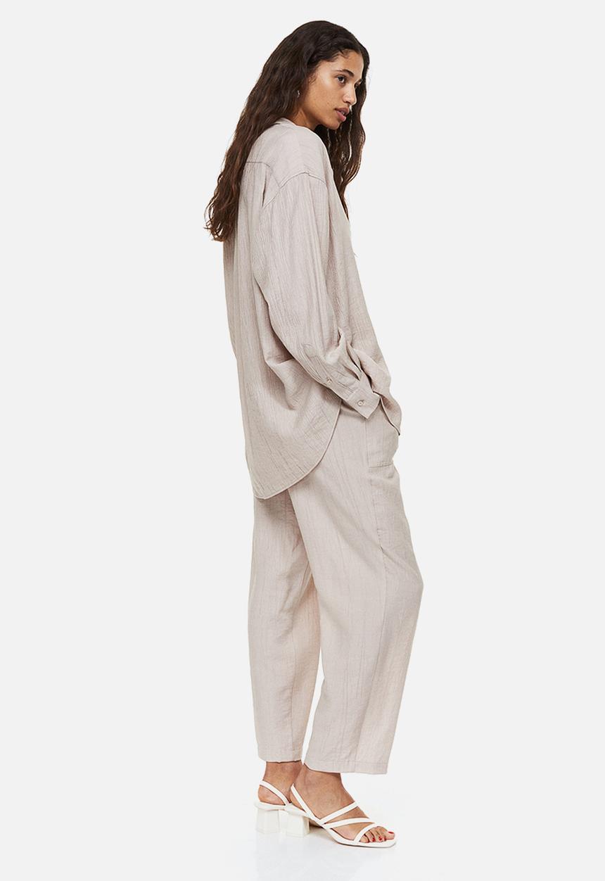 H&M - Tapered trousers - light beige 