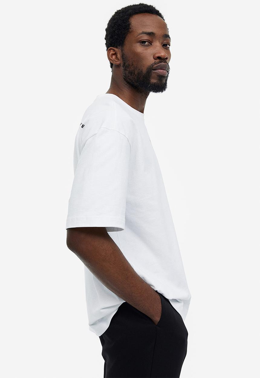 H&M - Relaxed fit printed T-shirt - white/keith haring 