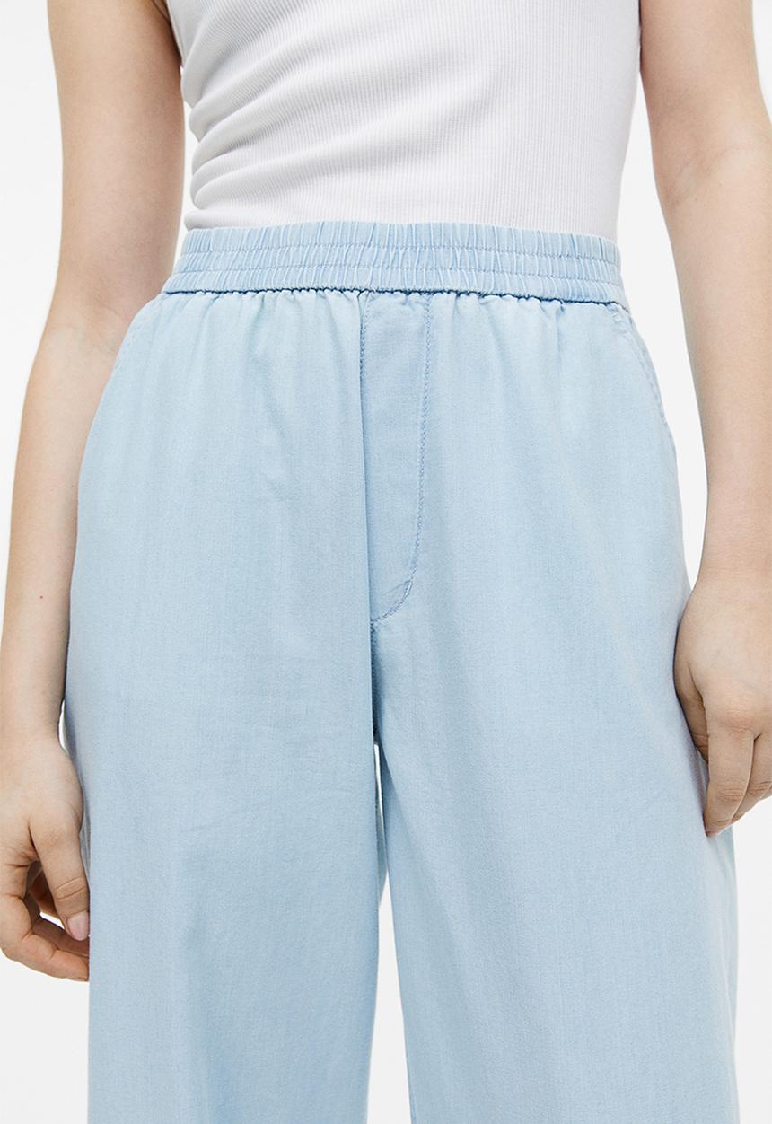 H&M - High-waisted woven joggers - light denim blue 