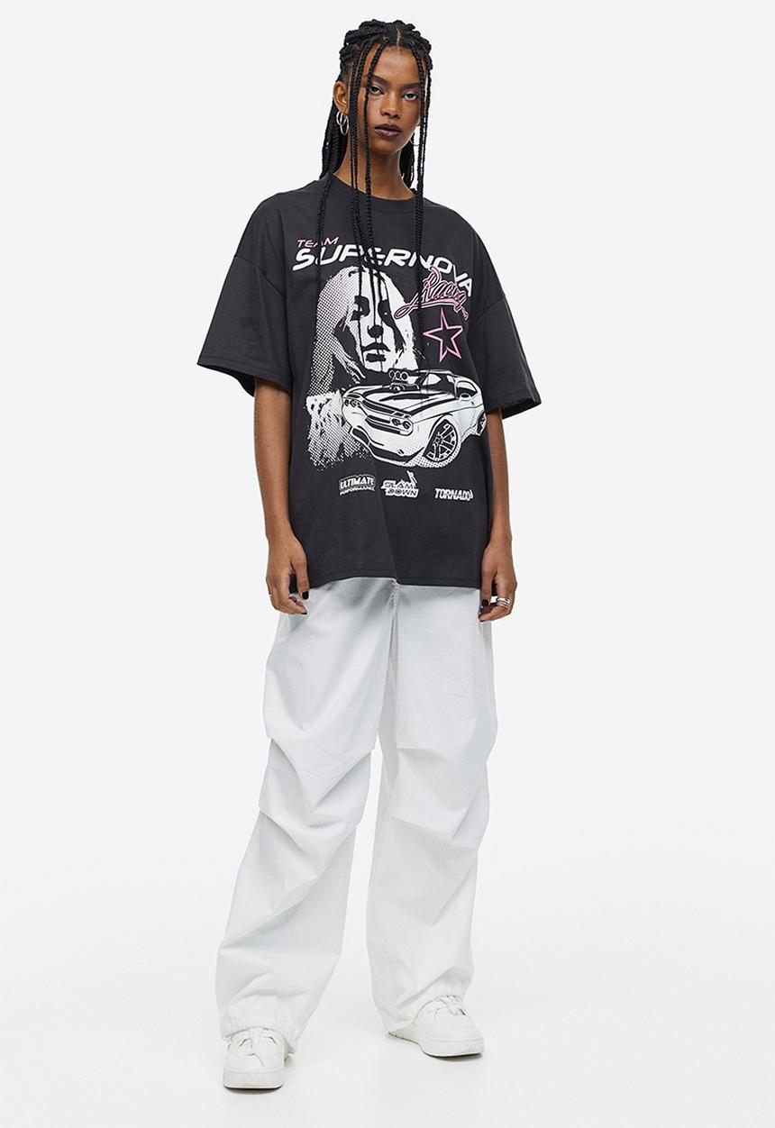 H&M - Oversized printed t-shirt - black / supernova 