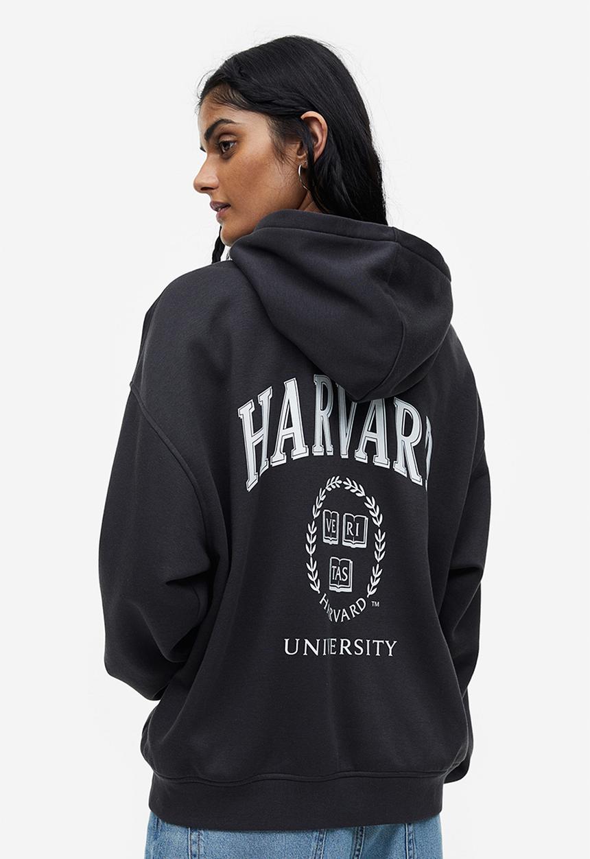 H&M - Oversized printed hoodie - black / harvard