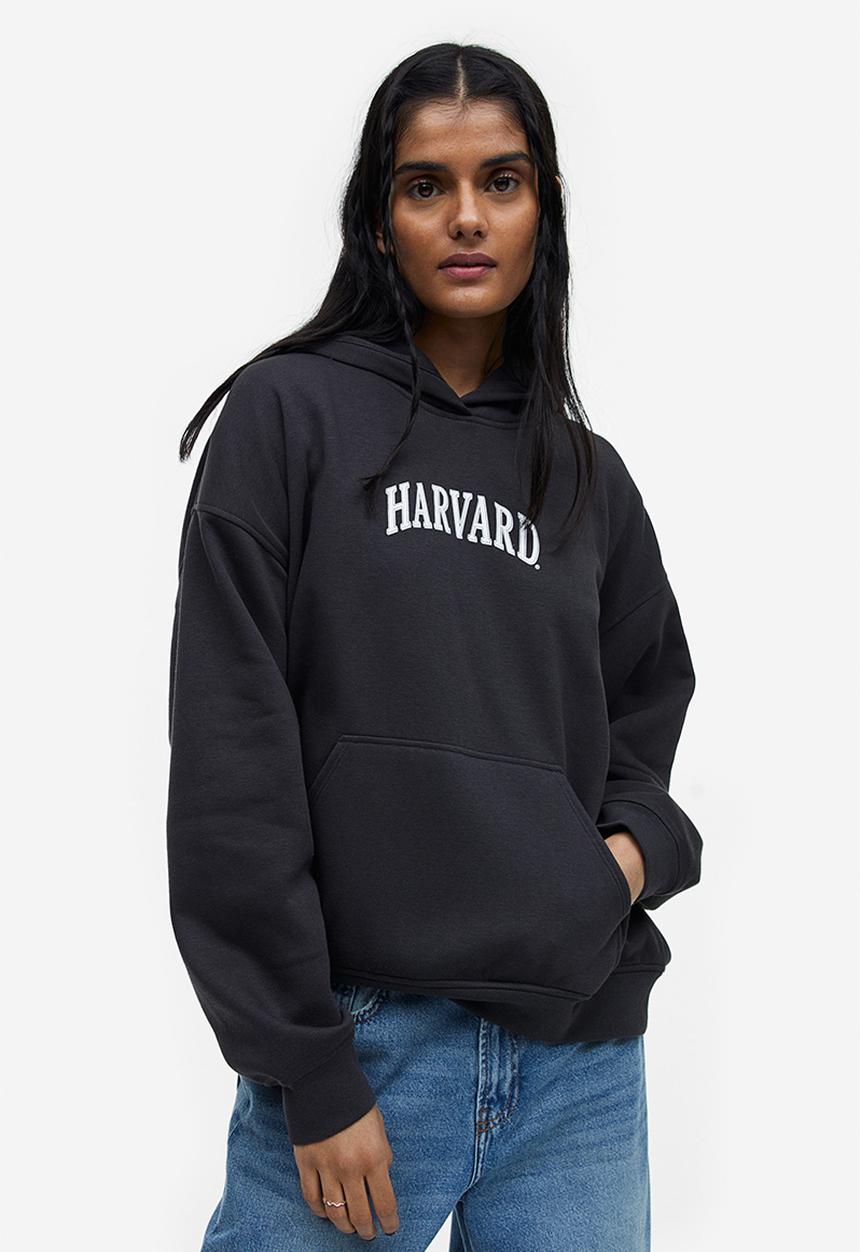H&M - Oversized printed hoodie - black / harvard