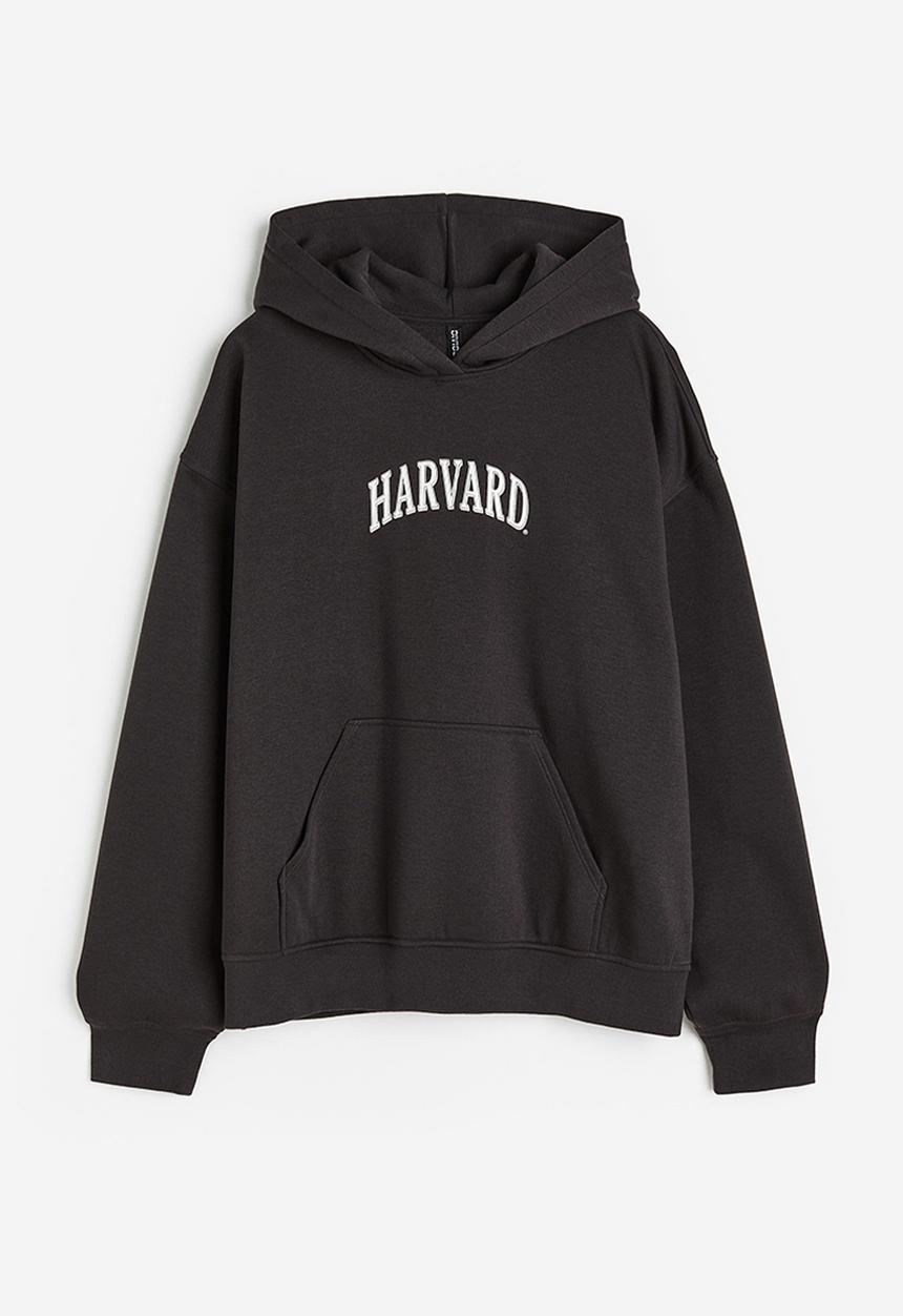 H&M - Oversized printed hoodie - black / harvard