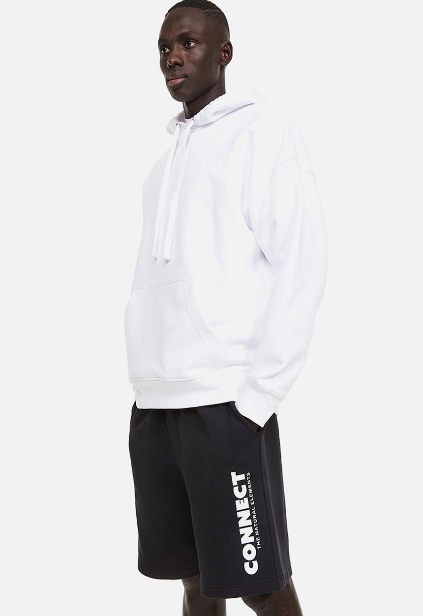 H&M - Relaxed fit printed sweatshorts - black connect 
