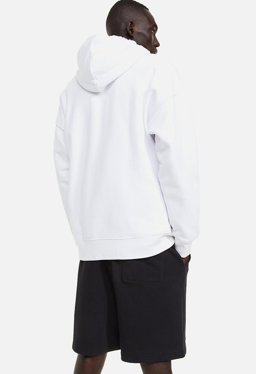 H&M - Relaxed fit printed sweatshorts - black connect 