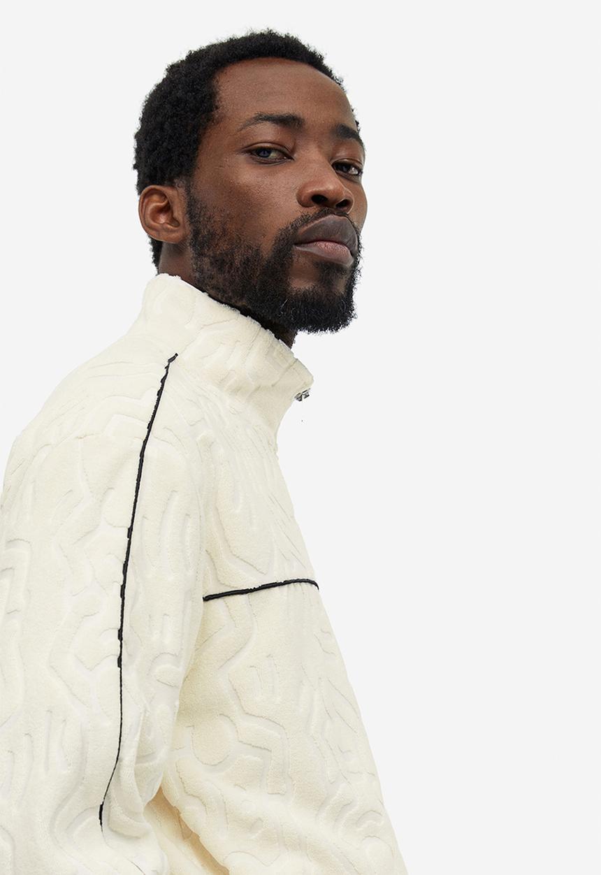 H&M - Relaxed fit terry track jacket - cream keith haring 