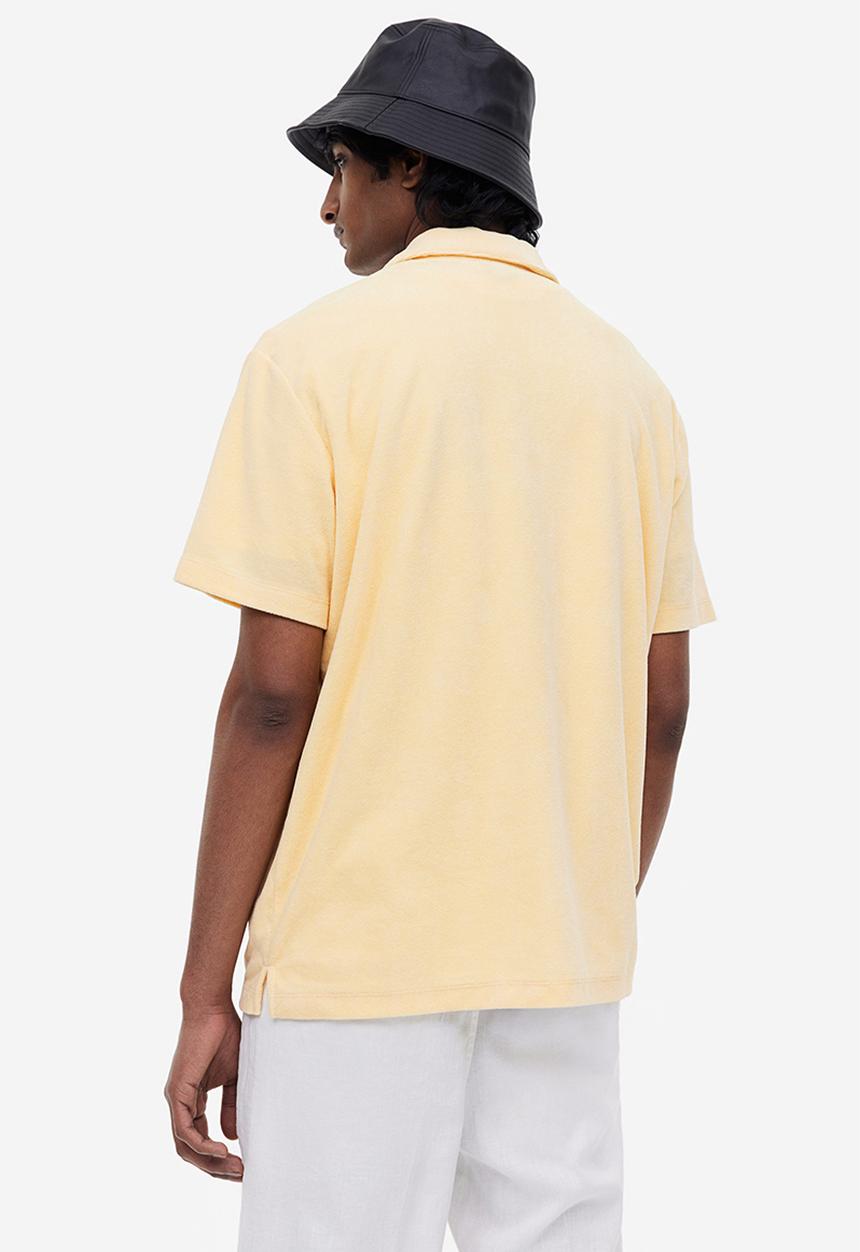 H&M - Regular fit terry polo shirt - light yellow