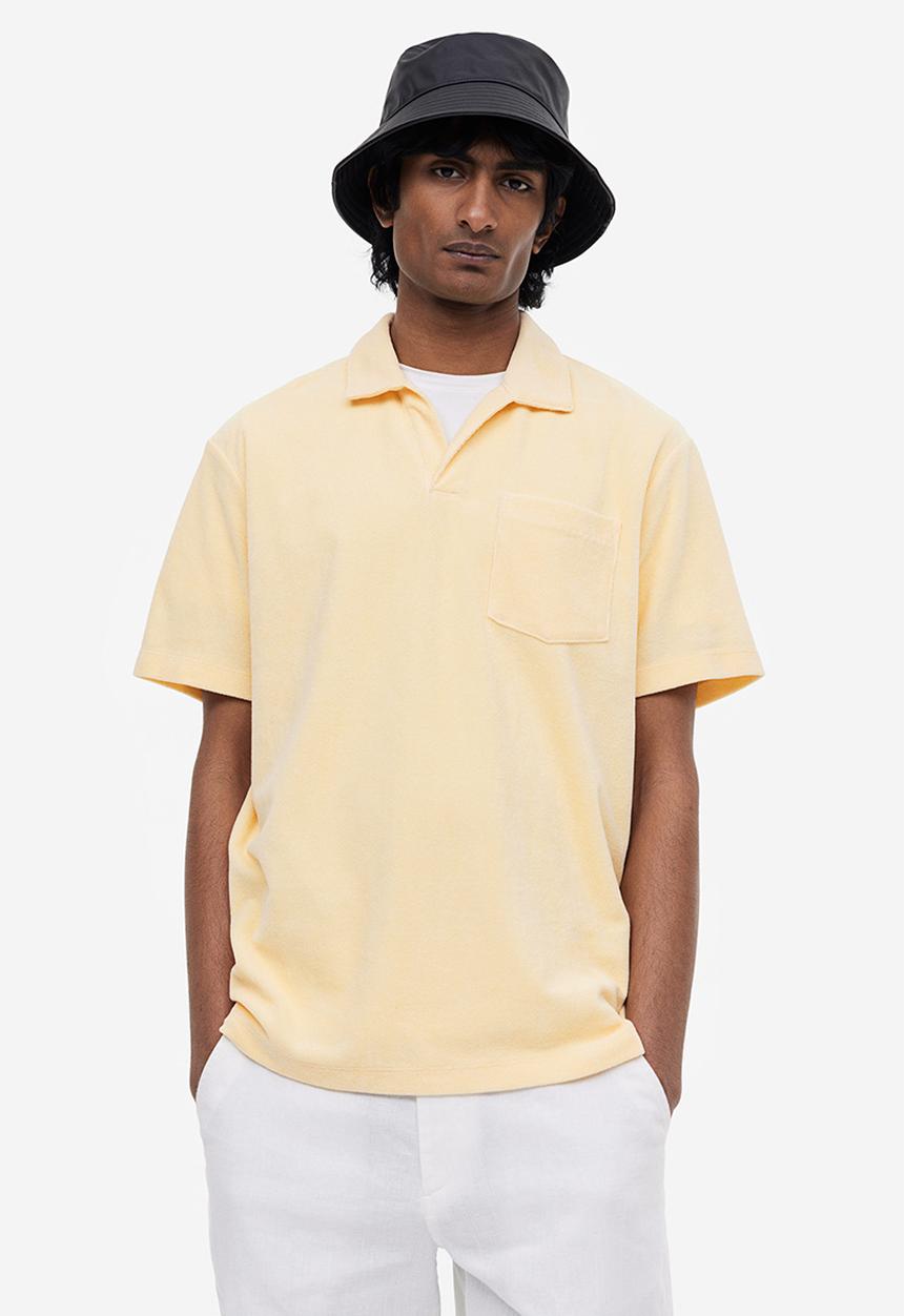 H&M - Regular fit terry polo shirt - light yellow