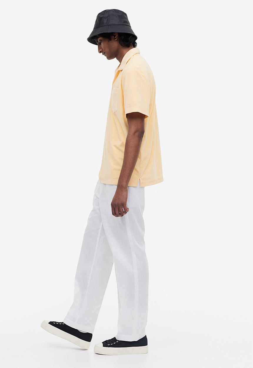 H&M - Regular fit terry polo shirt - light yellow