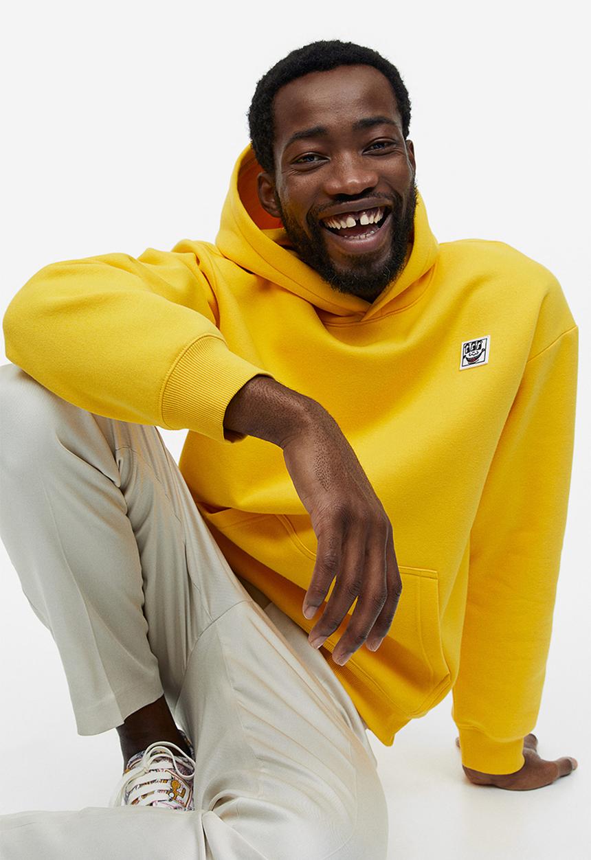 H&M - Relaxed fit hoodie - yellow keith haring