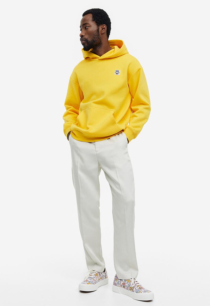 H&M - Relaxed fit hoodie - yellow keith haring