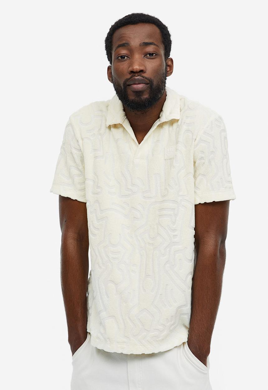 H&M - Regular fit terry polo shirt - cream keith haring