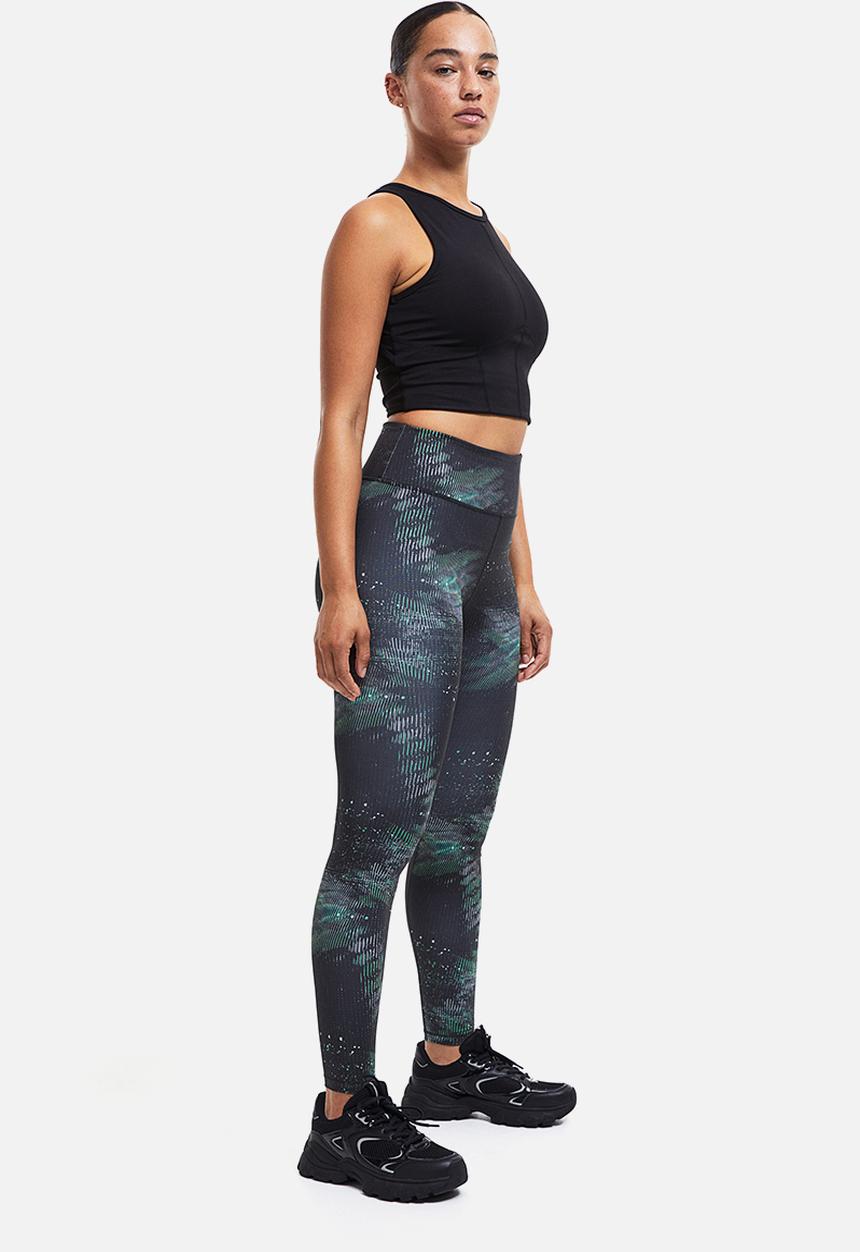 H&M - High waist sports tights - black/patterned