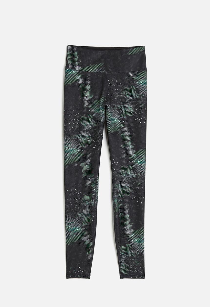 H&M - High waist sports tights - black/patterned
