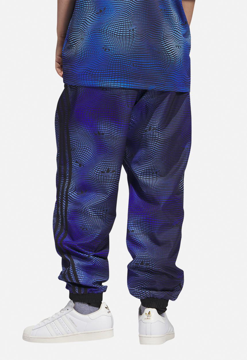 adidas Originals - MV Allover print track pants - blue