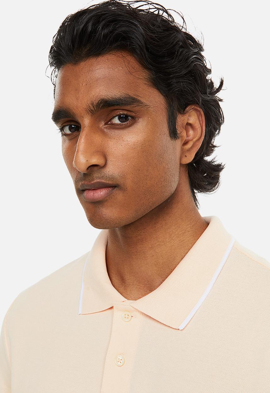 H&M - Slim fit cotton polo shirt - light apricot 