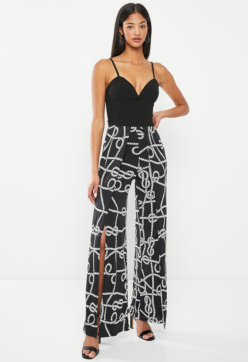 SISSY BOY - Mixed jumpsuit with leg opening - black chain print