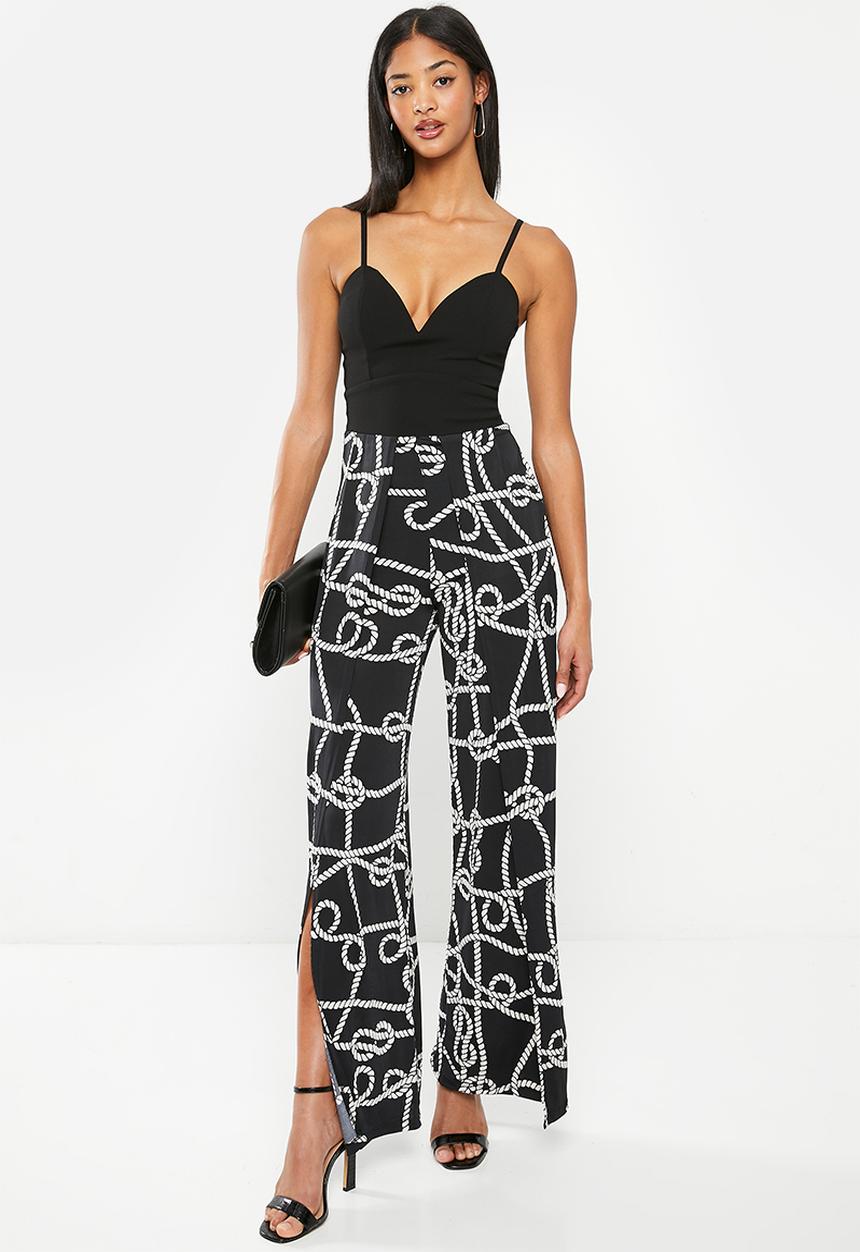 SISSY BOY - Mixed jumpsuit with leg opening - black chain print