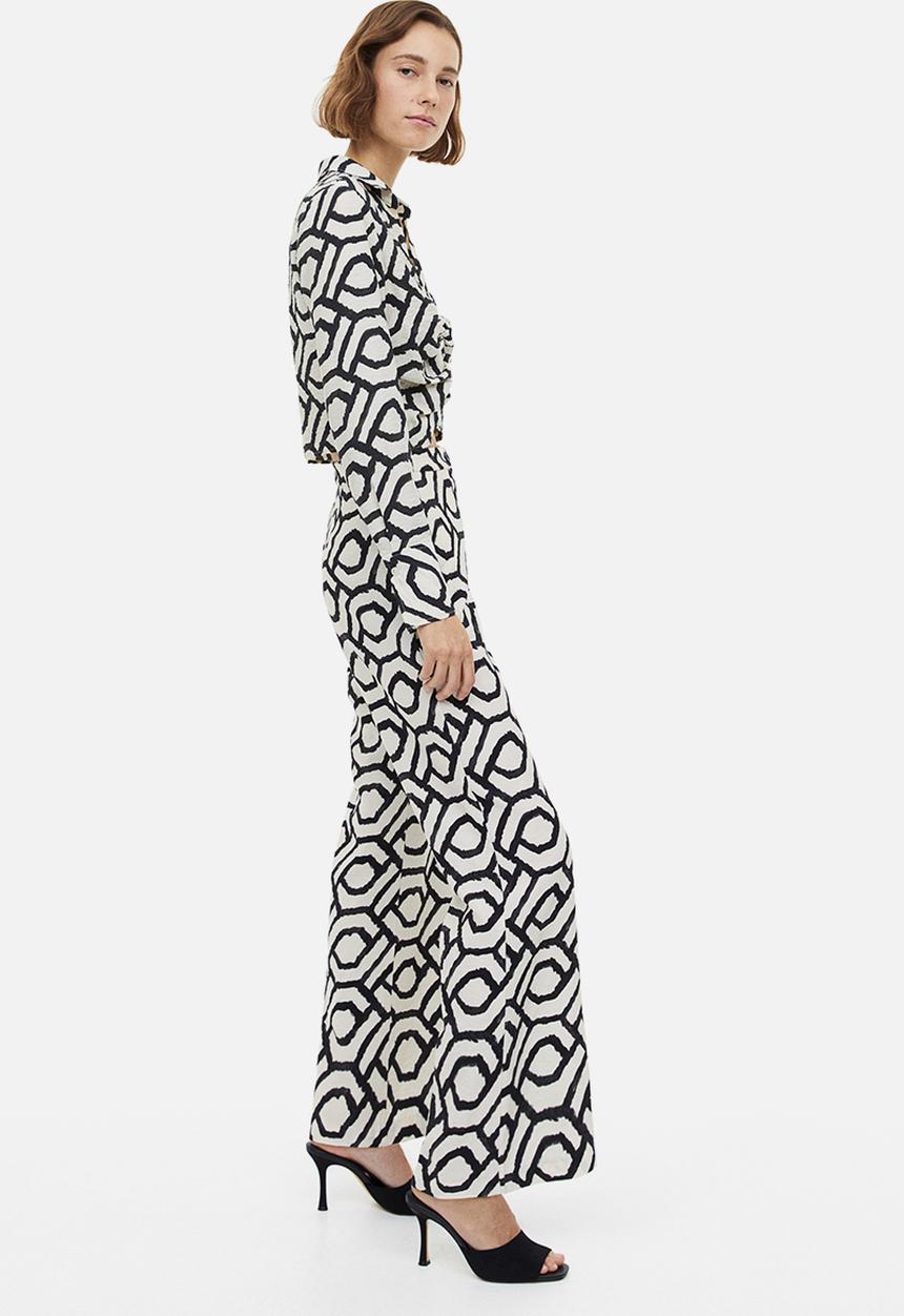 H&M - Flared trousers - cream patterned 