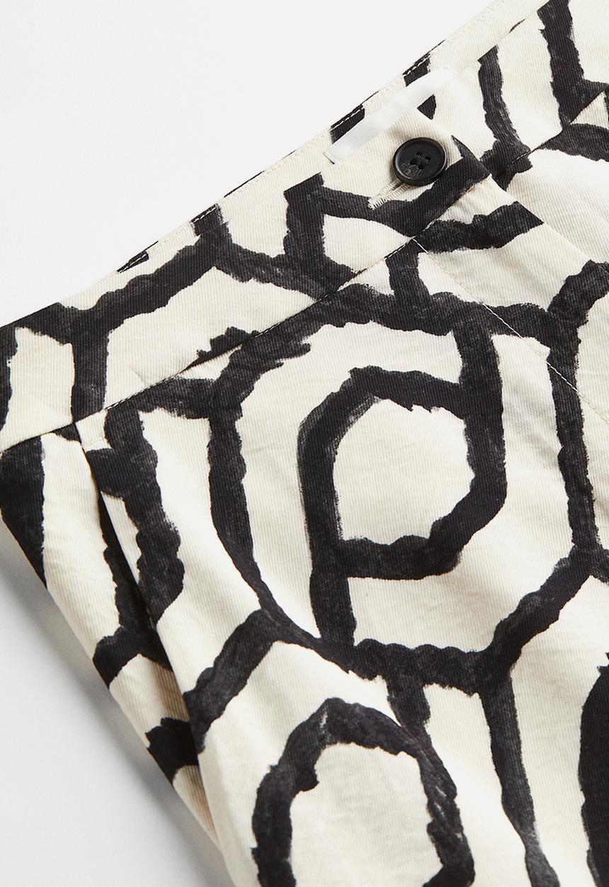H&M - Flared trousers - cream patterned 