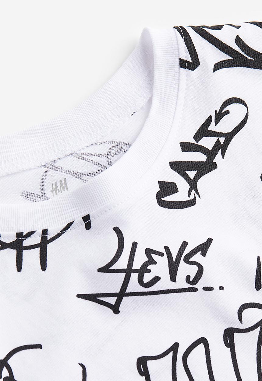 H&M - Printed cotton t-shirt - white / scribble 