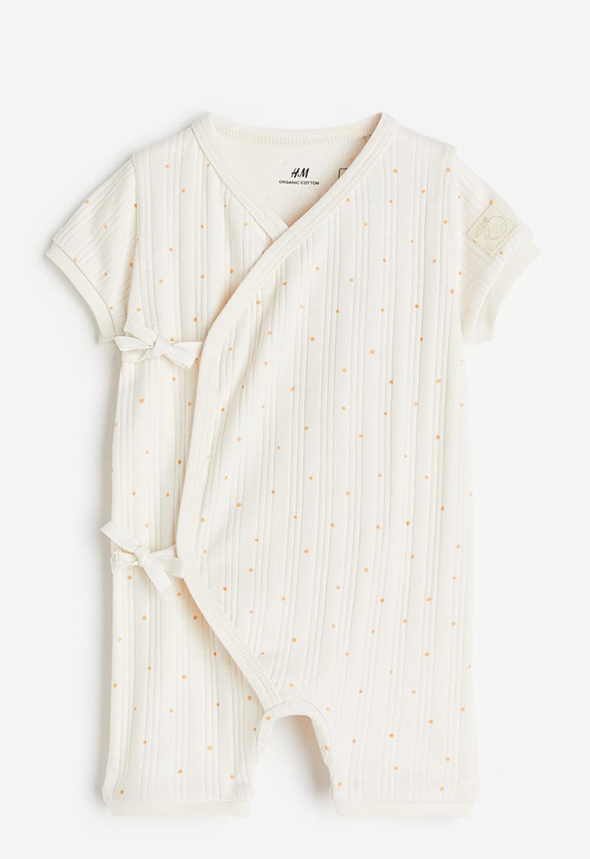 H&M - Wrapover cotton romper suit - white / spotted 