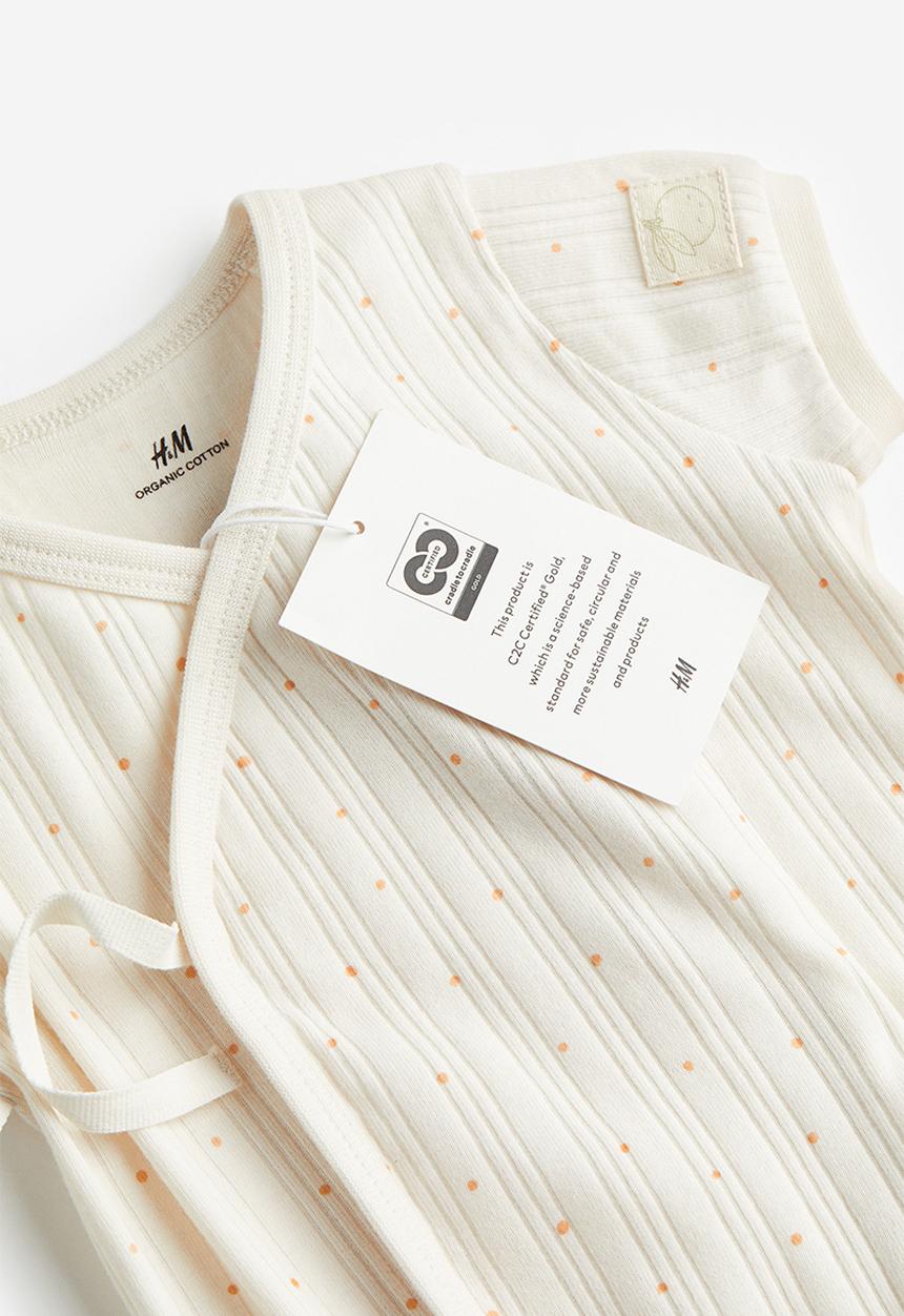 H&M - Wrapover cotton romper suit - white / spotted 