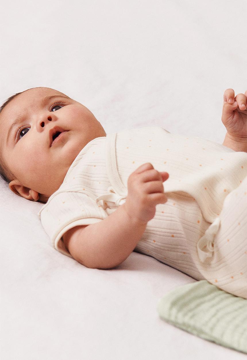 H&M - Wrapover cotton romper suit - white / spotted 